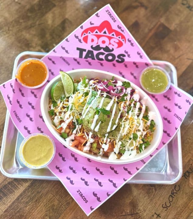 Taco bowl with rice, beans, avocado and crema