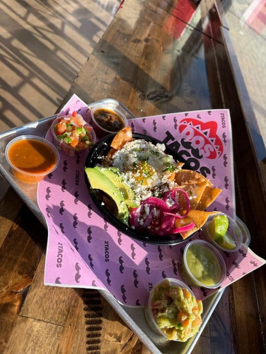 Chilaquiles with avocado, crema and pickled onion