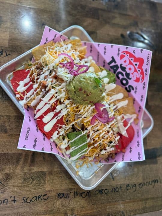 Loaded nachos with guacamole and crema