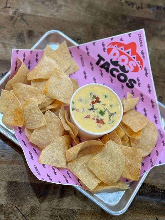 Warm queso with fresh tortilla chips